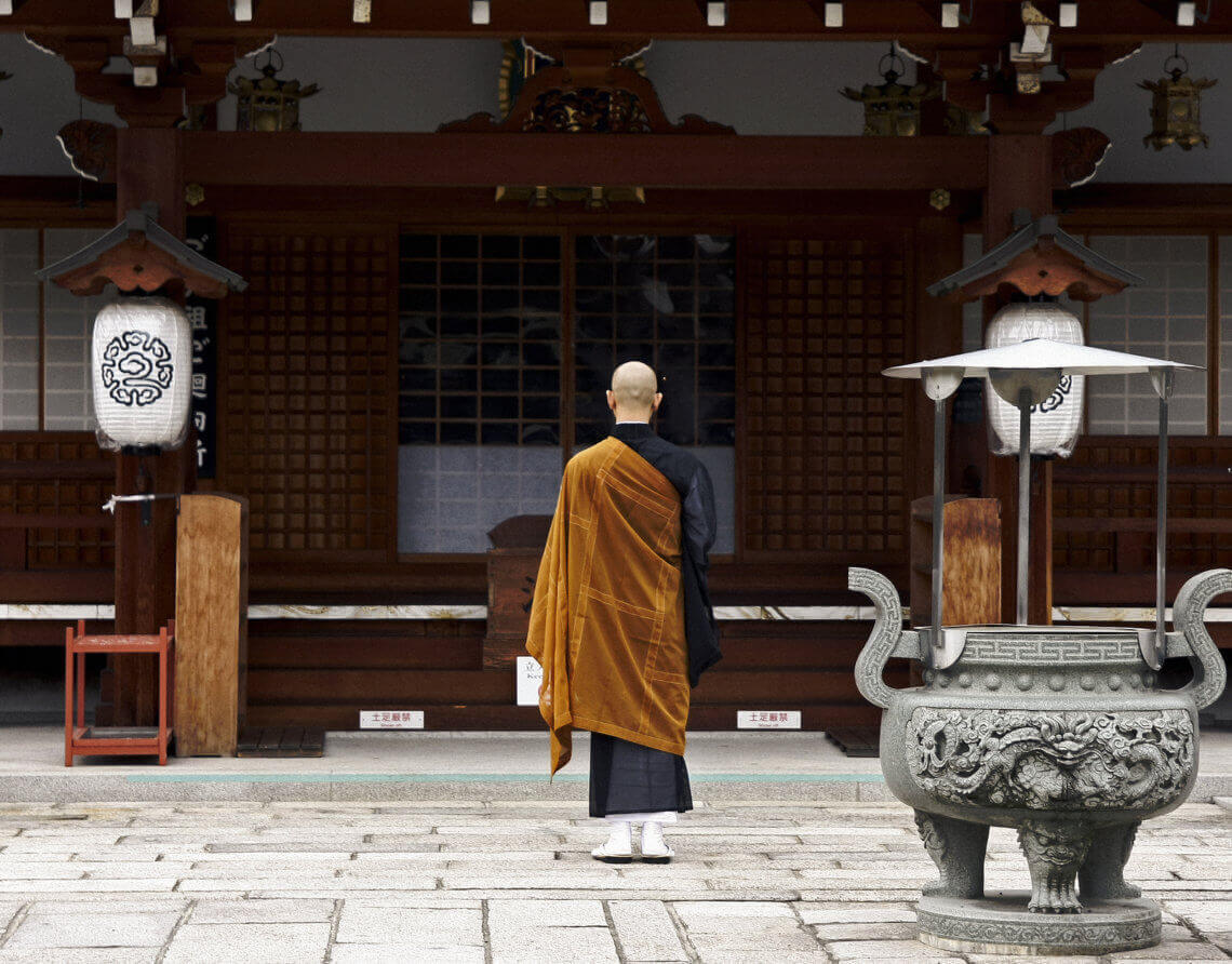 Buddhist monk at temple in Kyoto. You Have to Eat These Dishes in Kyoto, by Boutique Japan.