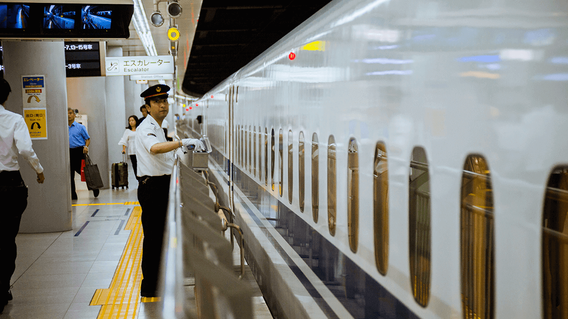 A bullet train (shinkansen) conductor monitoring the train