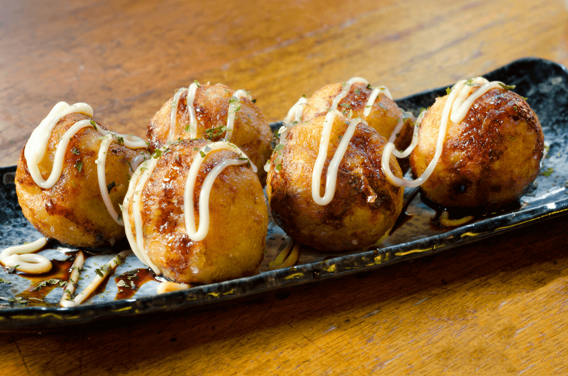 Takoyaki in Osaka. You Have To Eat These Dishes in Osaka, by Boutique Japan.